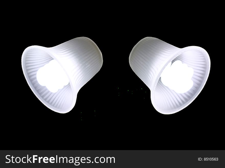 A photo of two fluorescent fixture lights isolated on black. A photo of two fluorescent fixture lights isolated on black