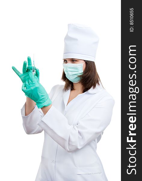 Young doctor prepares for injection over white background