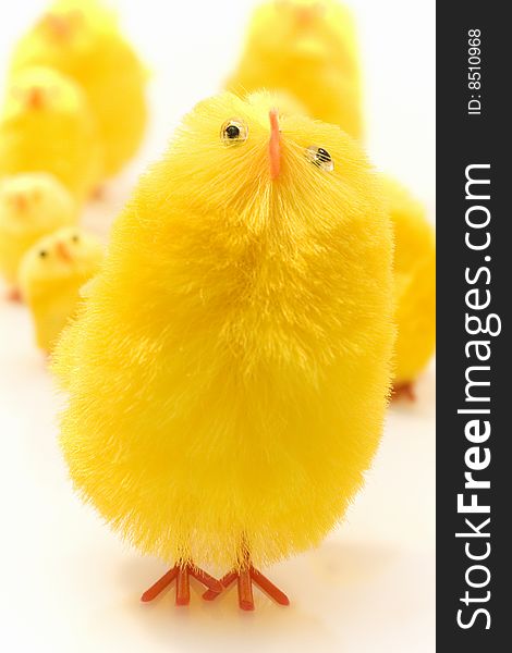 Small yellow estern toys on white background