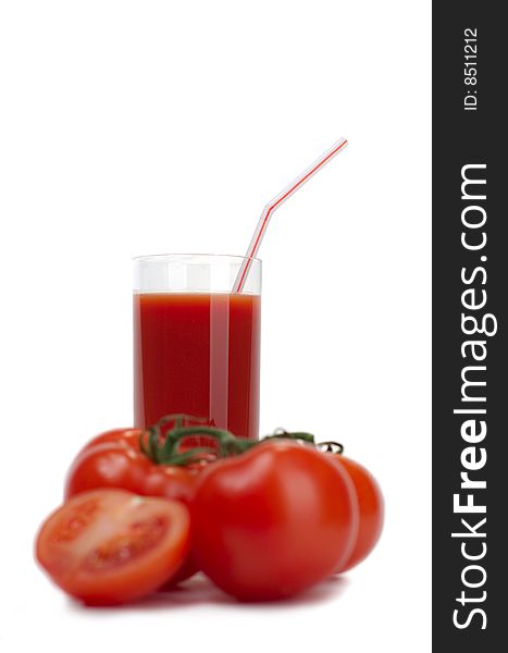 Fresh juicy tomatoes and tomato juice on a white background