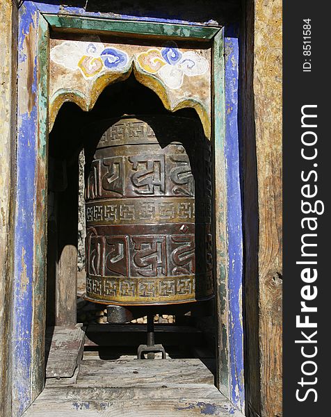 Traditional praying wheels at the entrance and exit of Nepali villagers on the Annapurna trail. Traditional praying wheels at the entrance and exit of Nepali villagers on the Annapurna trail