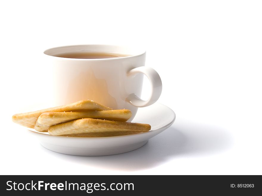 Cup of tea and some cookies on white background