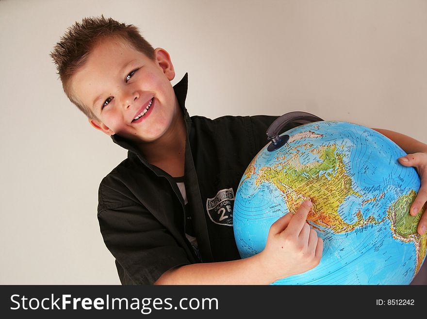 Boy is holding the world in his hands. Boy is holding the world in his hands