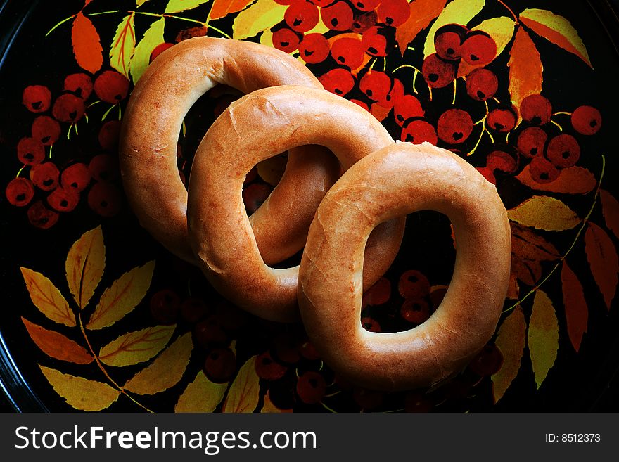 Bagels on tray with mountain ash pattern