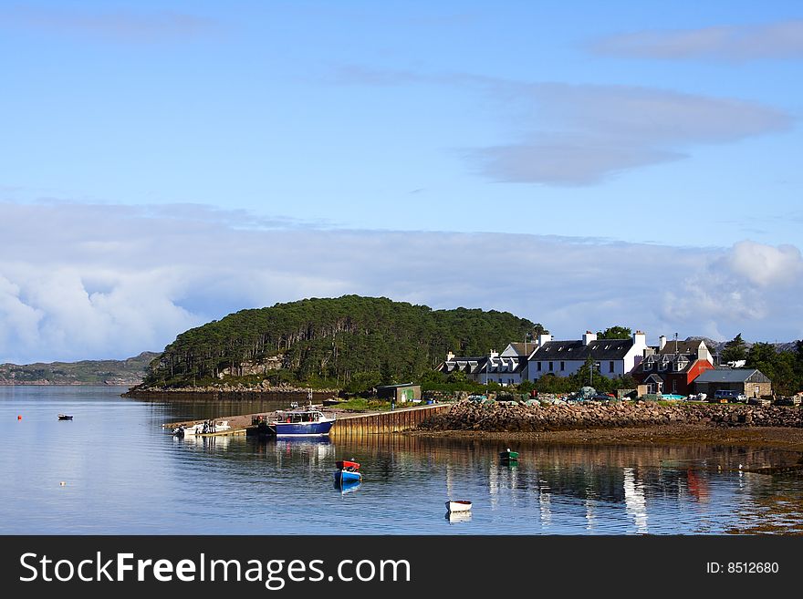 Plockton bay in scotland during summer with a view on the calm loch carron. Plockton bay in scotland during summer with a view on the calm loch carron