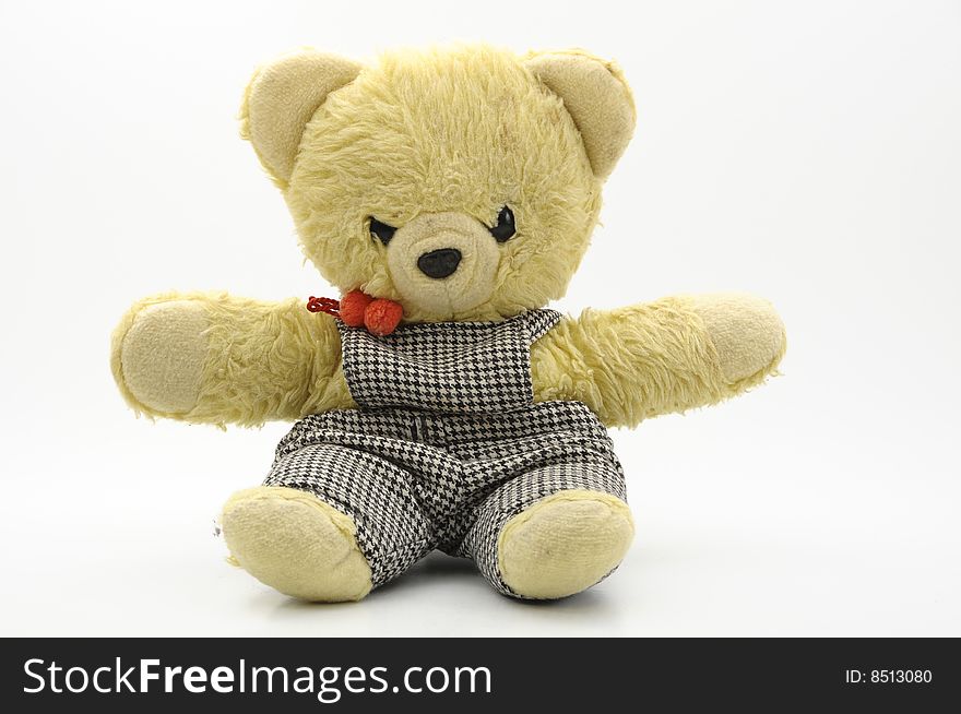 Yellow teddy bear against white background