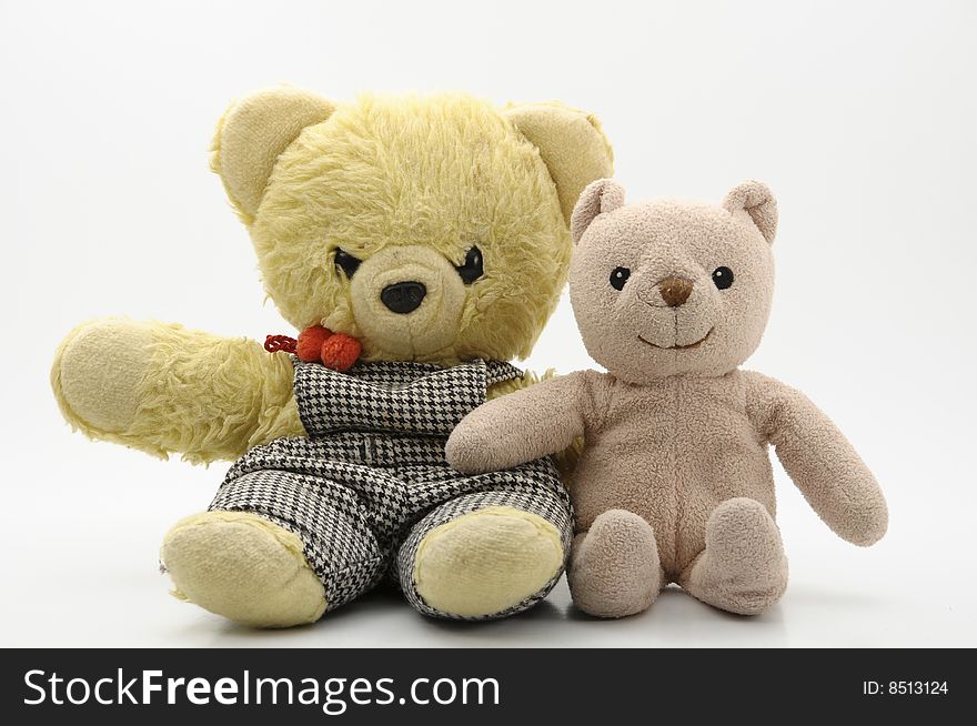 Two teddy bears against white background. Two teddy bears against white background