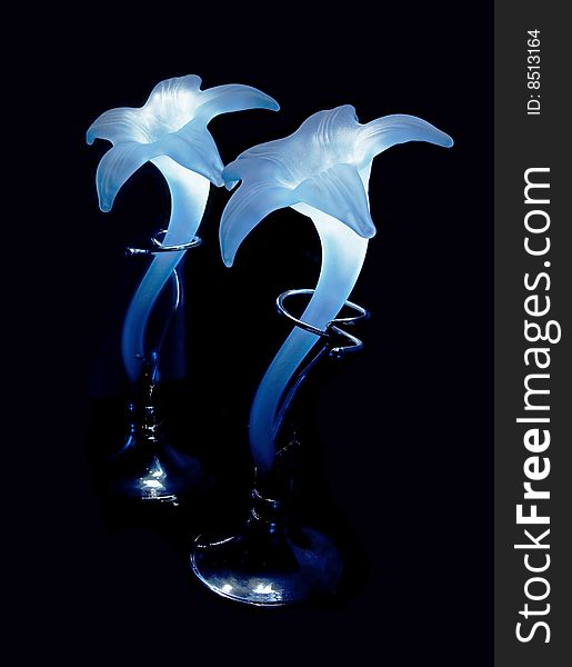 Glowing blue glass vase with silver stand. Glowing blue glass vase with silver stand