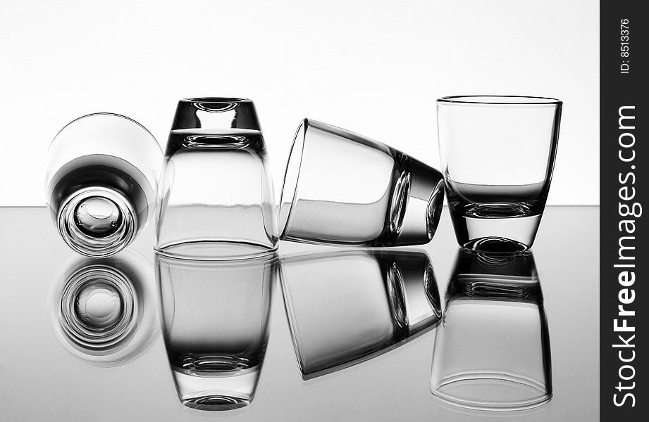 Set of the liquor-glasses on glass surface