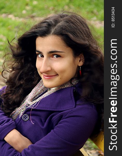 A caucasian girl smiling with waving hair with the wind. A caucasian girl smiling with waving hair with the wind