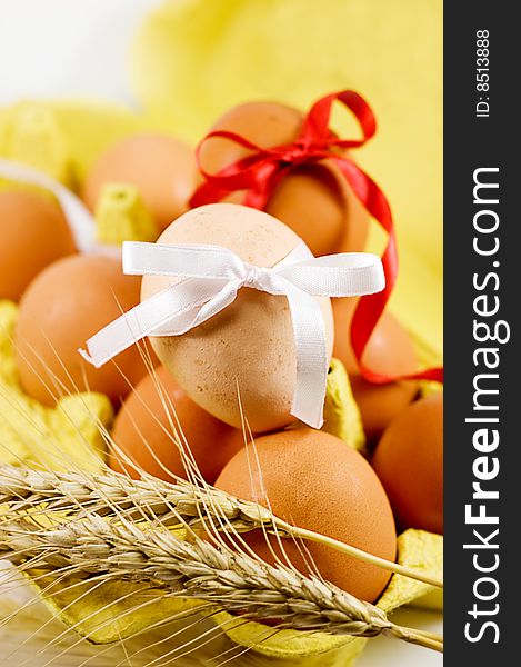 Eggs with red and white baw and wheat, easter concept. Eggs with red and white baw and wheat, easter concept