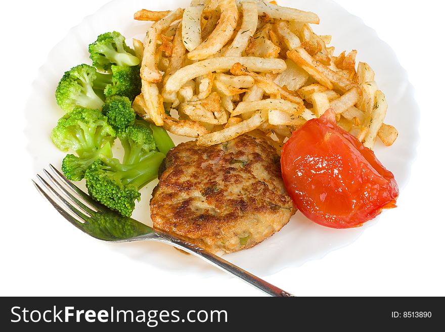 Cutlet with tomato, broccoli and potatoes on plate, isolated. Cutlet with tomato, broccoli and potatoes on plate, isolated