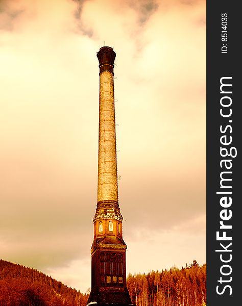 Brick factory chimney in late afternoon