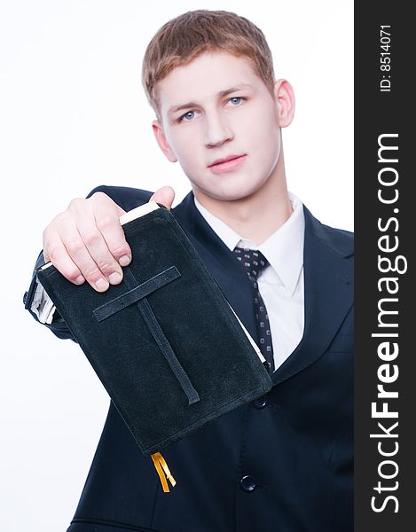 Young man showing Bible, selective focus