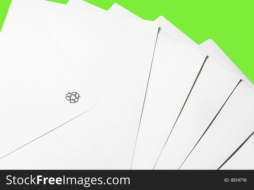 White envelopes against green background