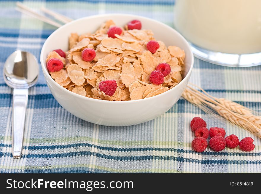 Flake Breakfast cereal with milk and raspberries