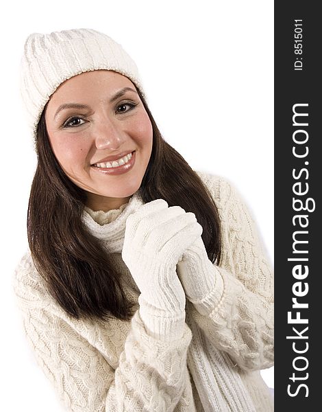 A pretty asian woman poses in winter clothing in front of an isolated background. A pretty asian woman poses in winter clothing in front of an isolated background