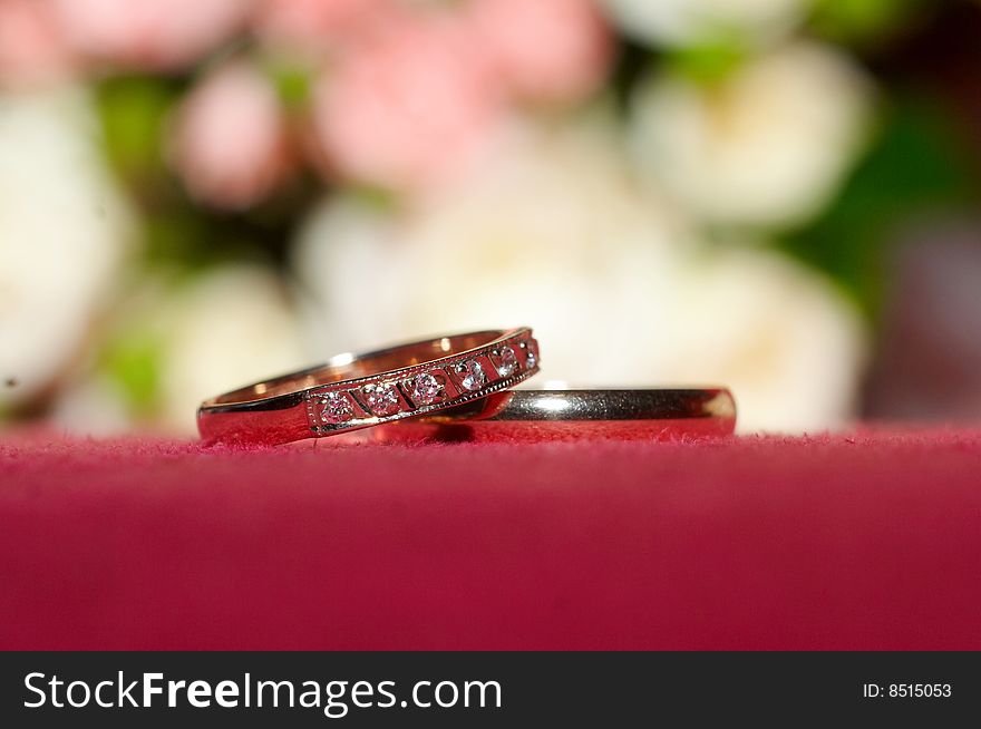 Wedding rings on red cloth