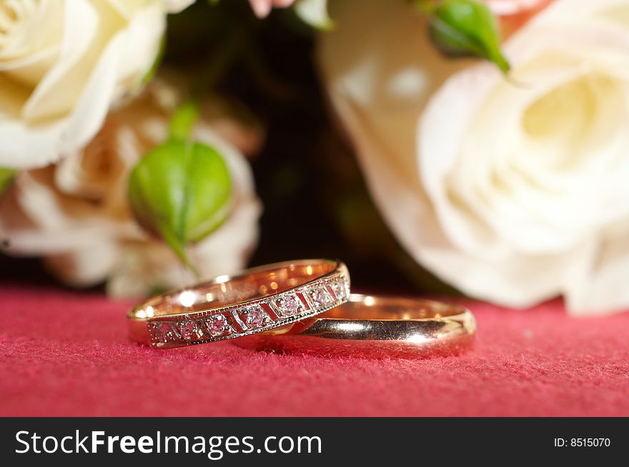 Wedding rings on red cloth