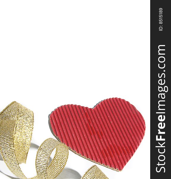 Background with cardboard heart of red color and a gold tape.