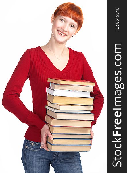 Young redhaired girl with book on white background