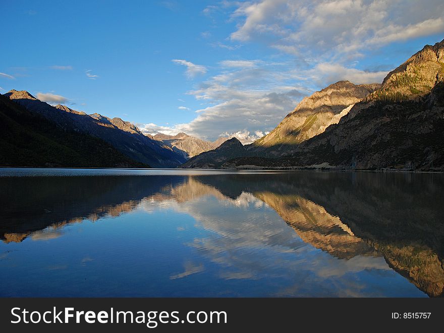 Mountain and sky reflected in the beautiful alpine Lake. Mountain and sky reflected in the beautiful alpine Lake