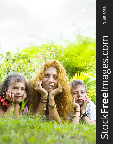 Portrait of little kids with mama having good time in summer environment. Portrait of little kids with mama having good time in summer environment