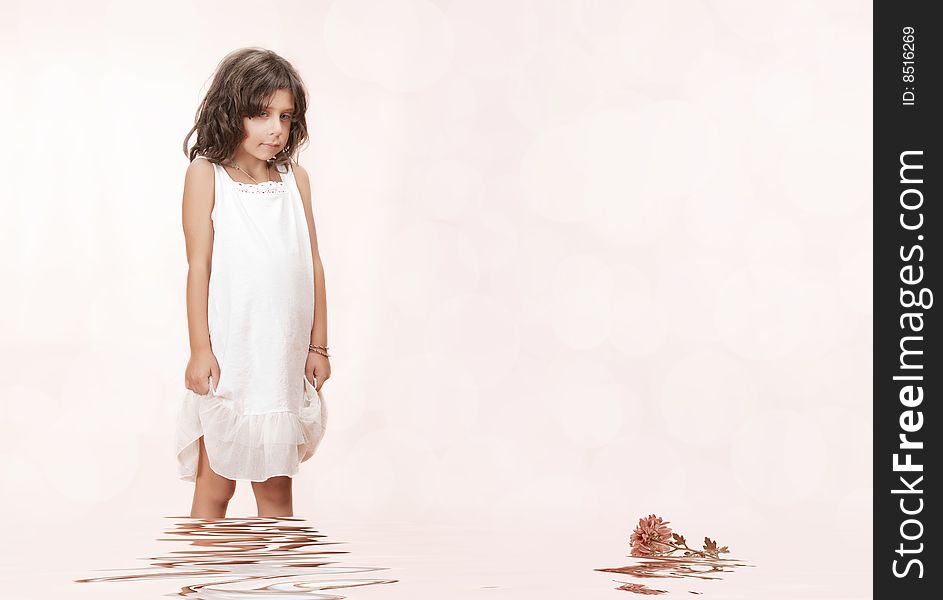 Studio portrait of  nice little girl getting through the water. Studio portrait of  nice little girl getting through the water