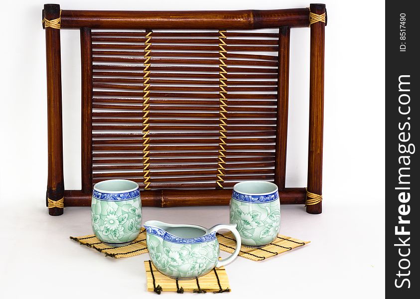The Chinese porcelain tea-things on the white background