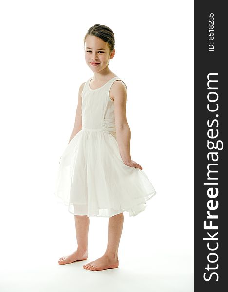 Little girl smiling in camera isolated on white background. Showing an elegant white dress. Little girl smiling in camera isolated on white background. Showing an elegant white dress.