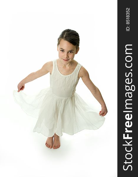Little girl smiling in camera isolated on white background. Showing an elegant white dress. Little girl smiling in camera isolated on white background. Showing an elegant white dress.