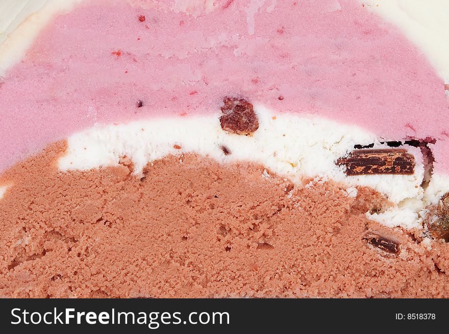 Colorful Ice-cream closeup with raisins and chocolate bits inside. Colorful Ice-cream closeup with raisins and chocolate bits inside