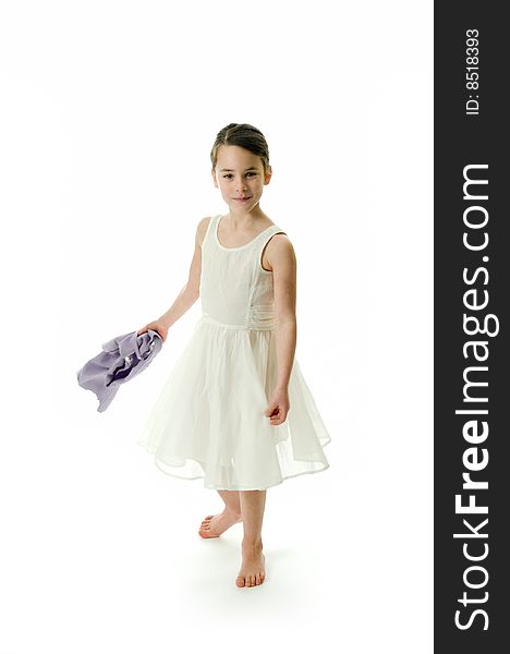 Little girl smiling in camera isolated on white background. Posing in an elegant white dress. Little girl smiling in camera isolated on white background. Posing in an elegant white dress.