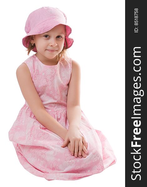 Girl in a pink dress and a hat isolated on a white background. Girl in a pink dress and a hat isolated on a white background