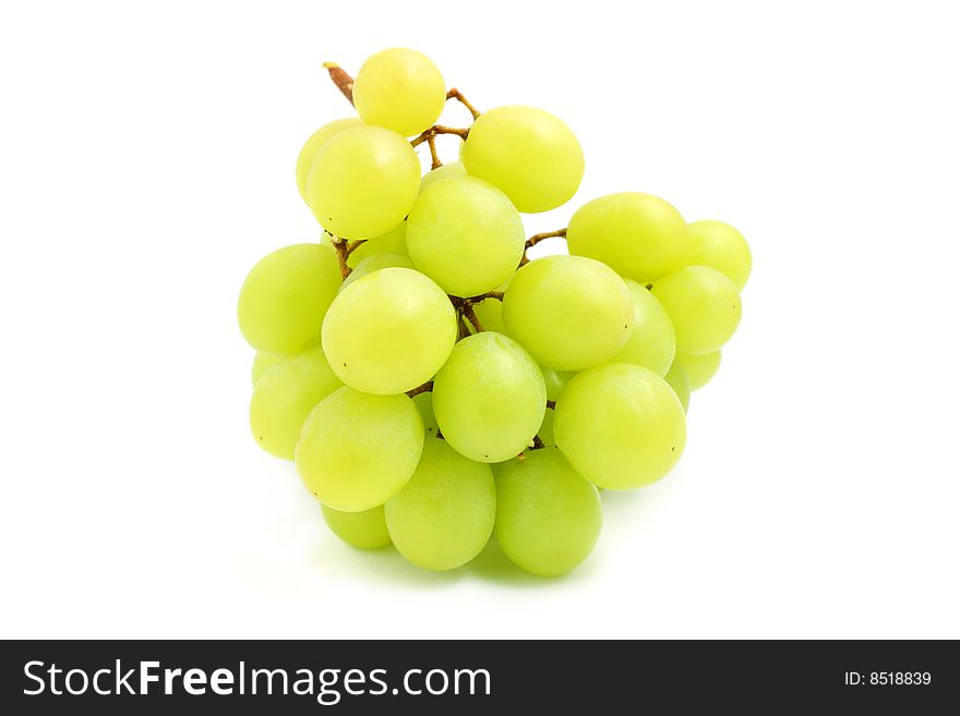 A big string of green grape isolated over white background.