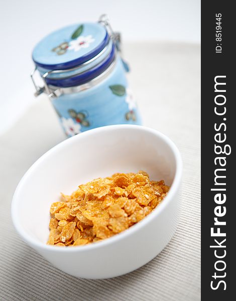 Milk and cornflakes on the white background