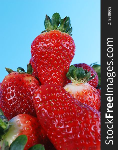 Closeup of big strawberries on plate vertical