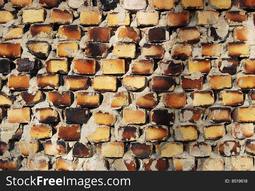 Old brick yellow wall covered by the sun. Old brick yellow wall covered by the sun