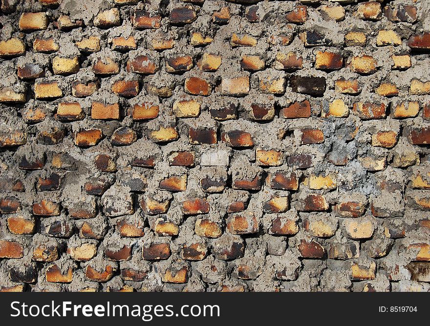 Old wall from yellow bricks