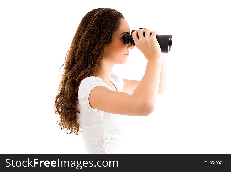 Side pose of female holding binocular with white background