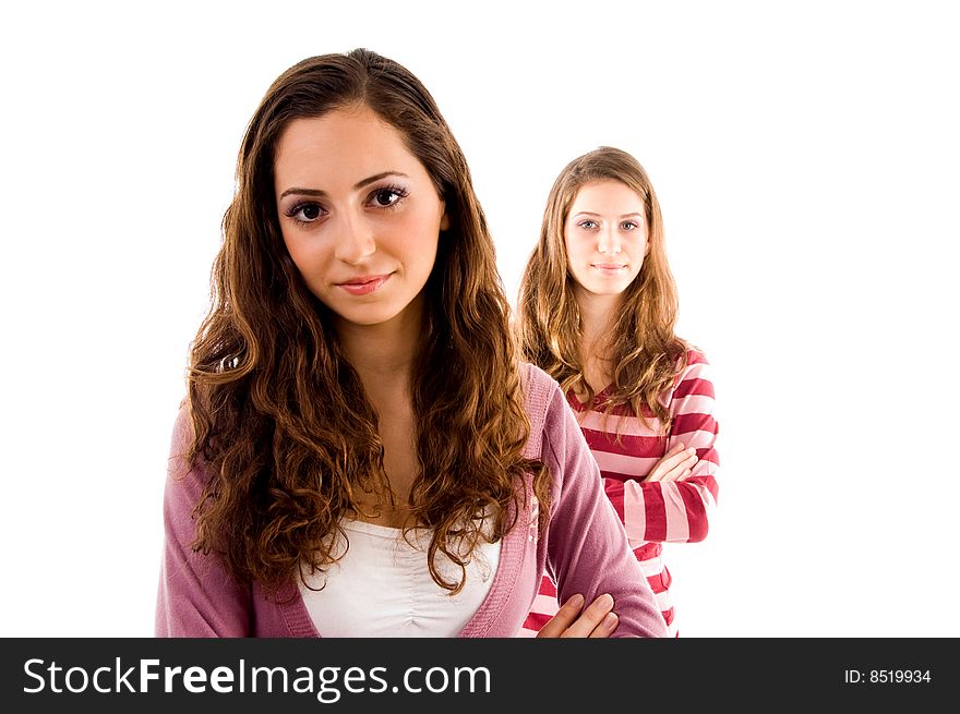 Young friends looking at camera against white background