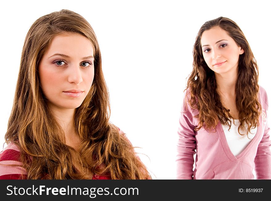 Portrait of young sisters with white background