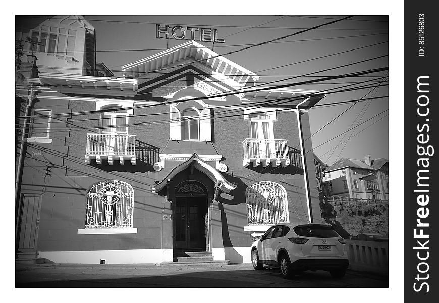 A monochrome photo of an old fashioned hotel in Cerro Castillo in Chile.