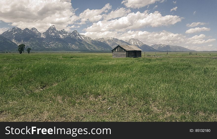 Barn On Mountain Field