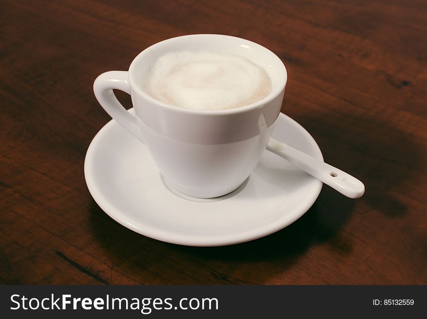 A cup of cappuccino with milk foam.