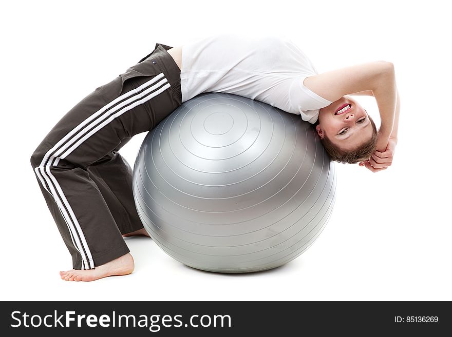 Woman in White Cap Shirt on Stability Ball