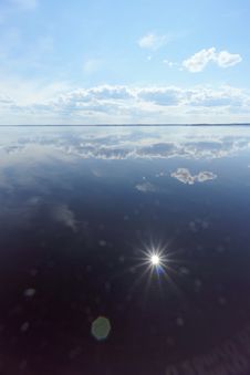 River View With Clouds Reflected In It, The Sun In The Frame And The Reflection Of The Sun, Volga, Russia Stock Images River View With Clouds Reflected In It, The Sun In The Frame And The Reflection Of The Sun, Volga, Russia Stock Images