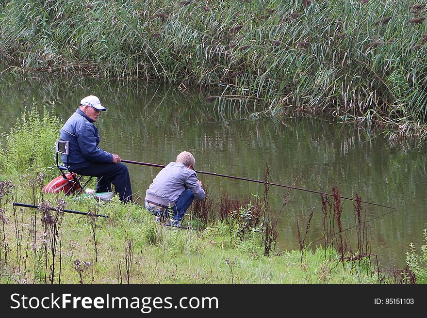 Grandpa Fishing With Kid
