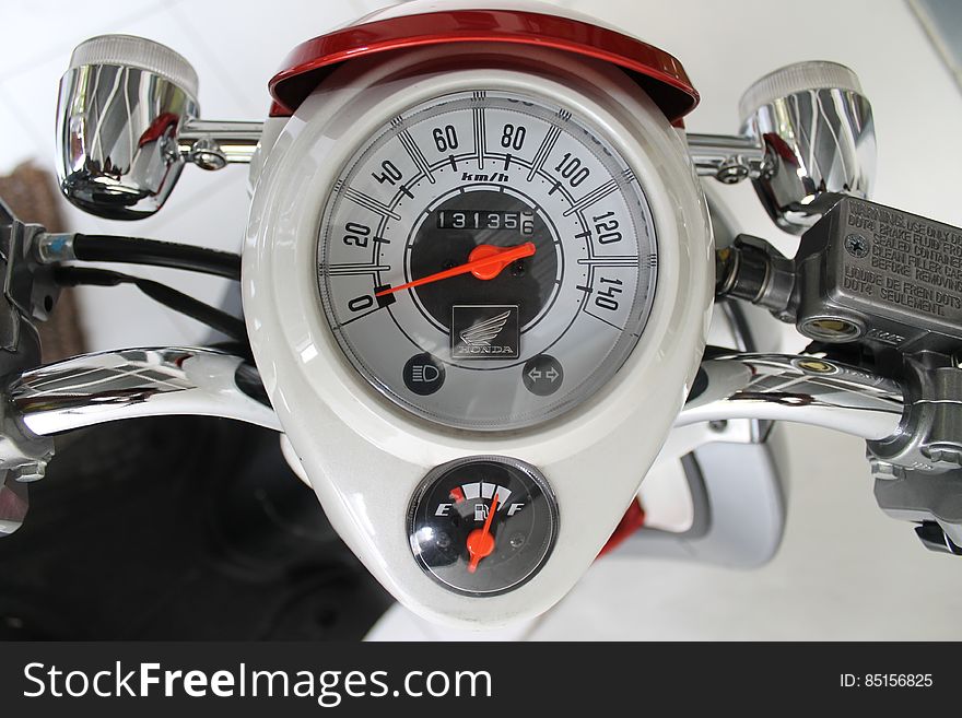 White and Red Motorcycle Gauge
