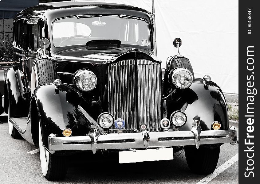 A black and white vintage car front.